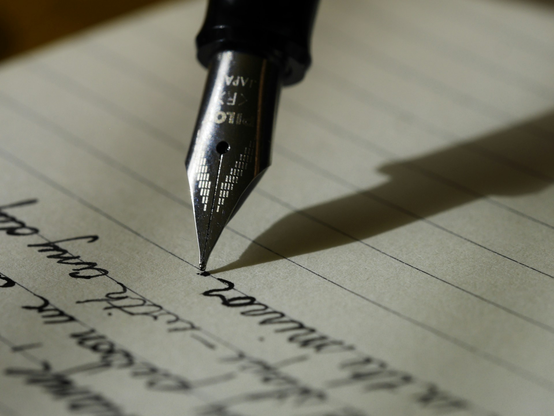 Person writing at a desk